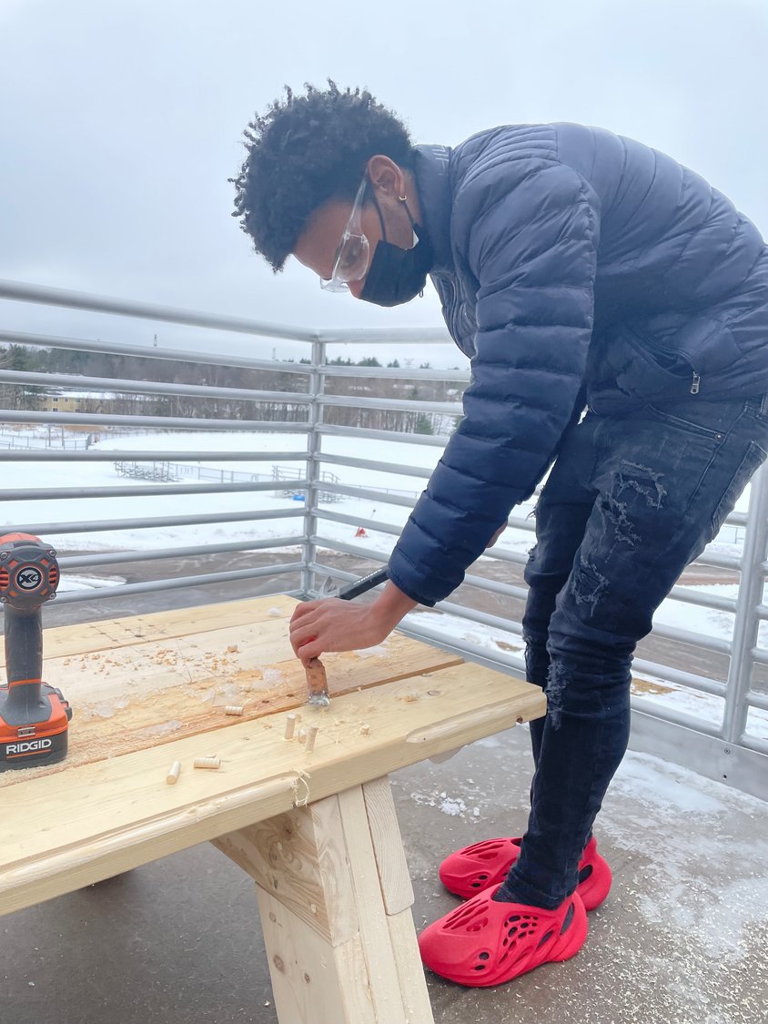 Despite the weather, students in the Monticello High School Wood 2 class worked hard on the benches destined for the R.J. Kaiser Middle School mindfulness area.